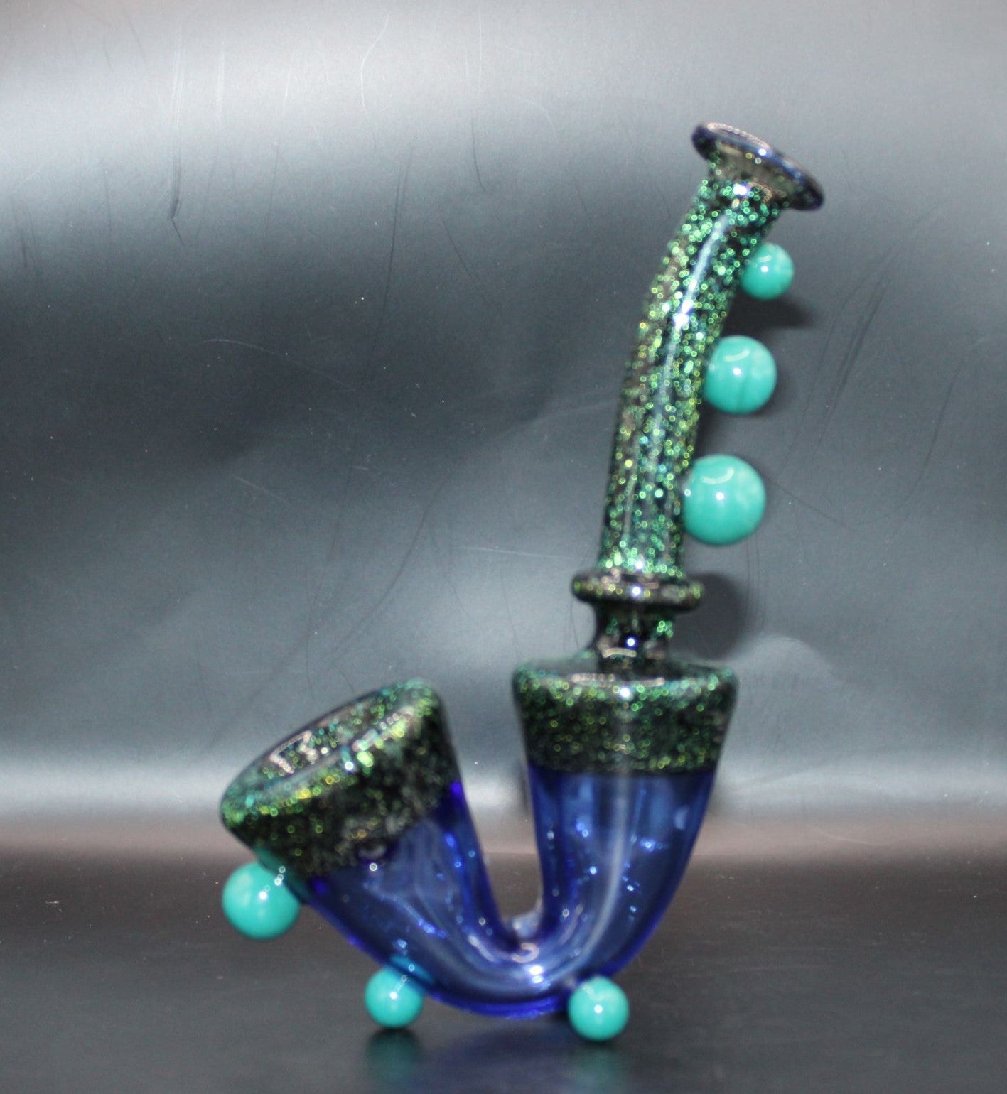 TURQUOISE DICHROIC STANDING SAXOPHONE